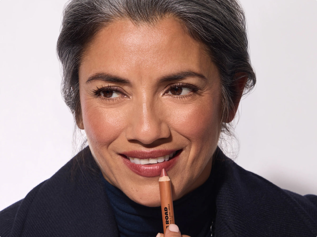 Model holding The Lip Crayon