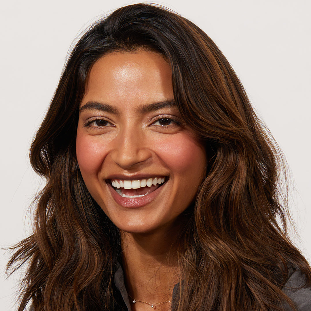 A woman wearing Jones Road Beauty's The Best Blush in shade POP