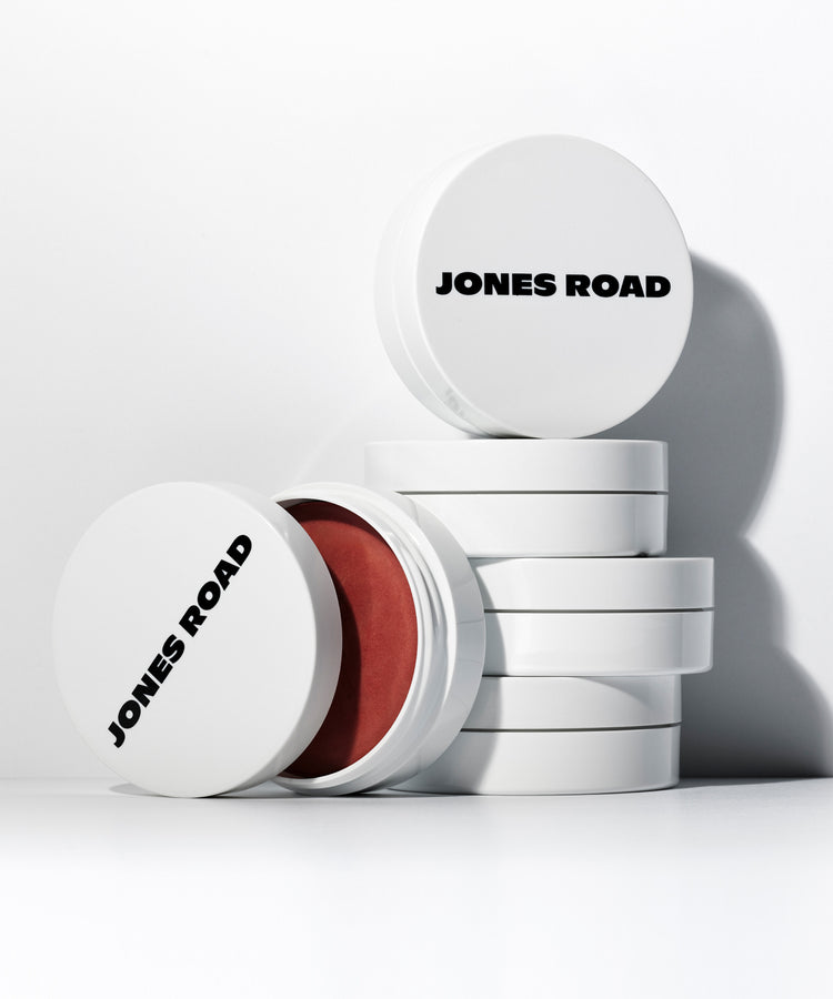 Jones Road clean makeup product containers stacked
